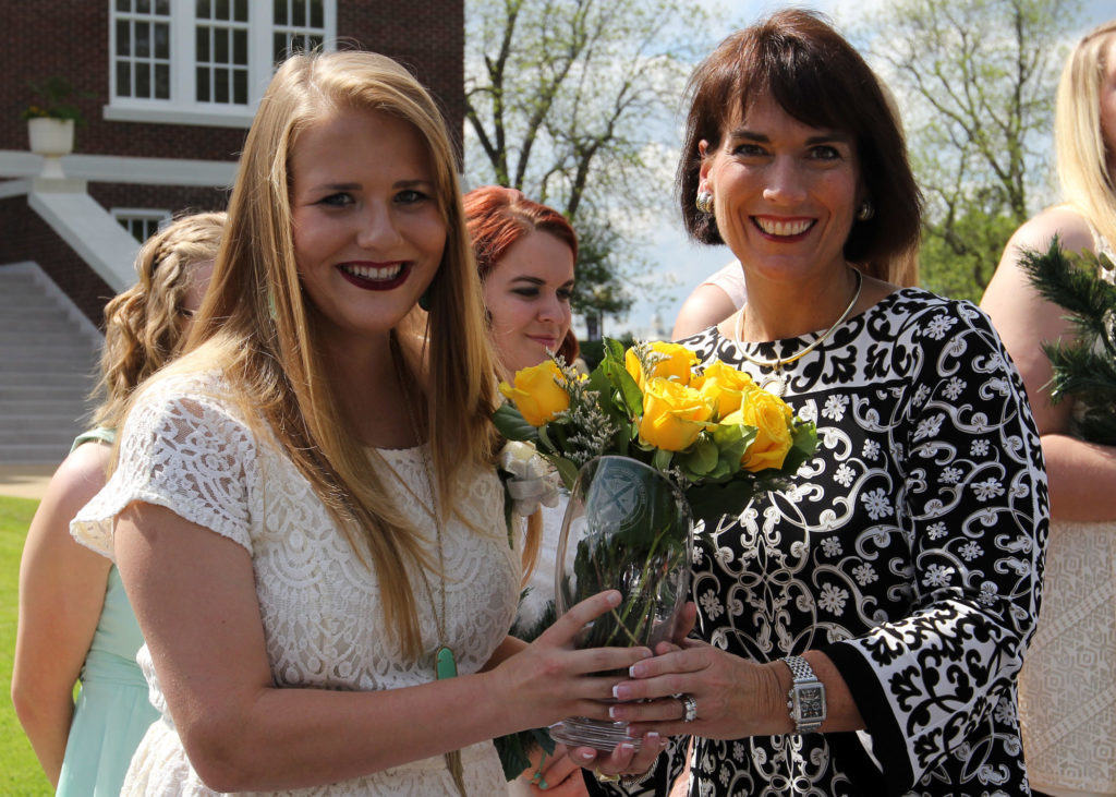East Texas Baptist University First Lady Michelle Blackburn presented roses to this year’s Senior Girl Call-Out recipient, Gabrielle Besch of Bonham.  The 69th ETBU Senior Girl-Call Out ceremony was held on the front lawn of Marshall Hall on Friday, April 15. PHOTO: ETBU/Mike Midkiff.  